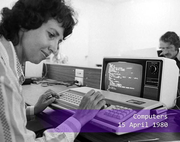 a woman using a personal computer in 1980