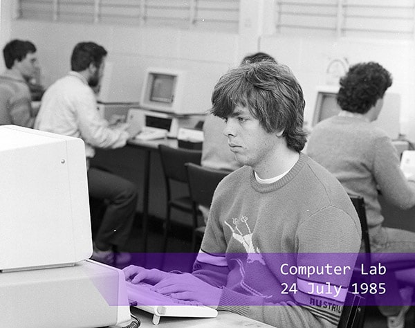 a student working in a computer lab in 1985