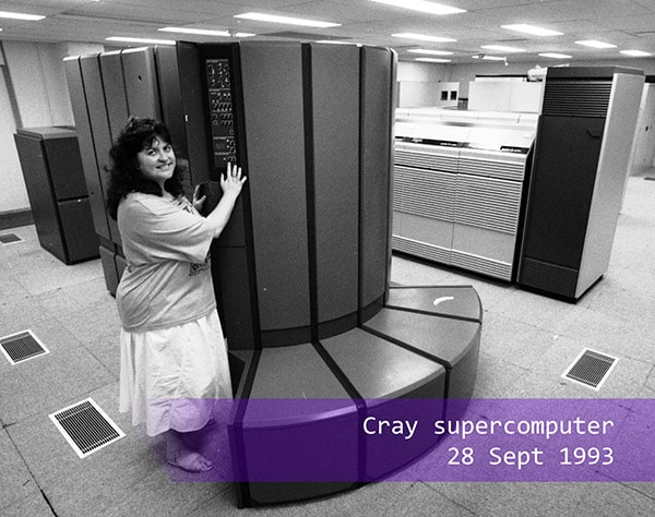 a woman standing next to the Cray supercomputer in 1993