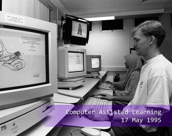 a student testing out the computer assisted learning in 1995