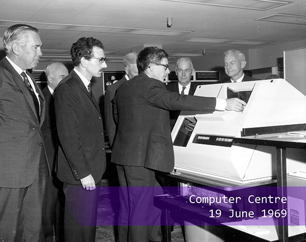 A group of men using the computer in 1969